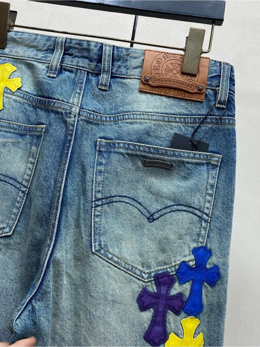 Chrome Hearts Blue Wide-Leg Jeans with Purple & Yellow Cross Appliqués